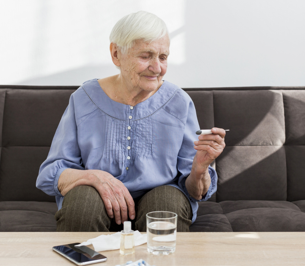 older-woman-home-checking-thermometer.jpg